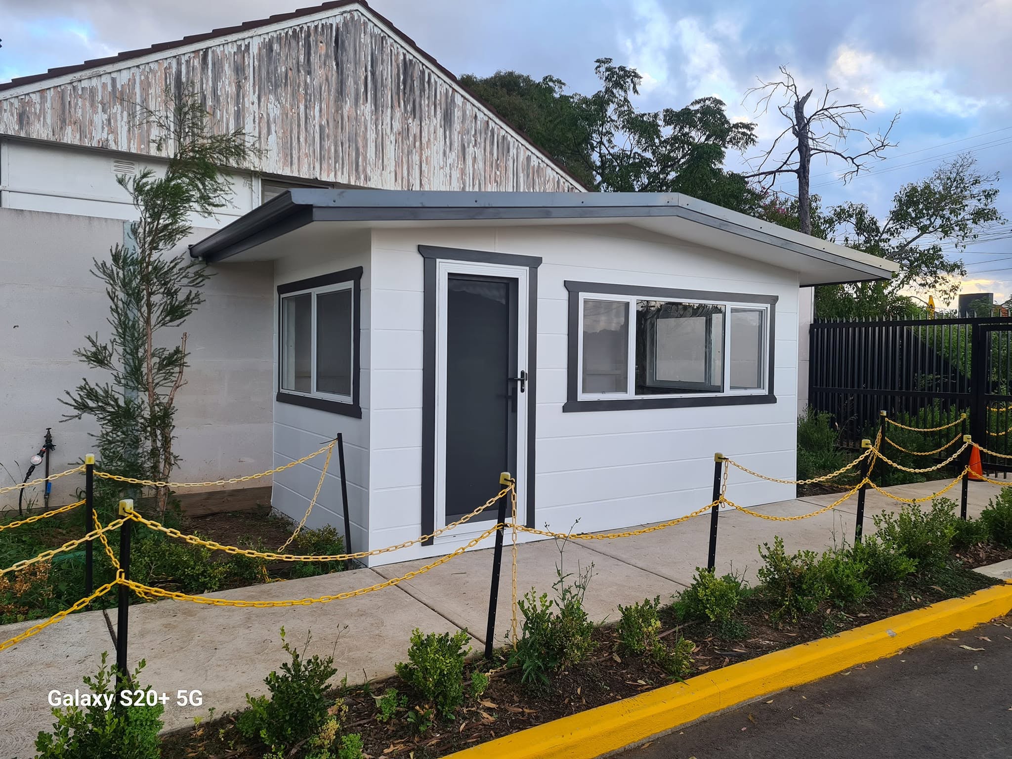 Completed Karhani project with white cladding and dark trim